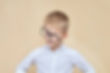 Boy in white shirt wearing glasses