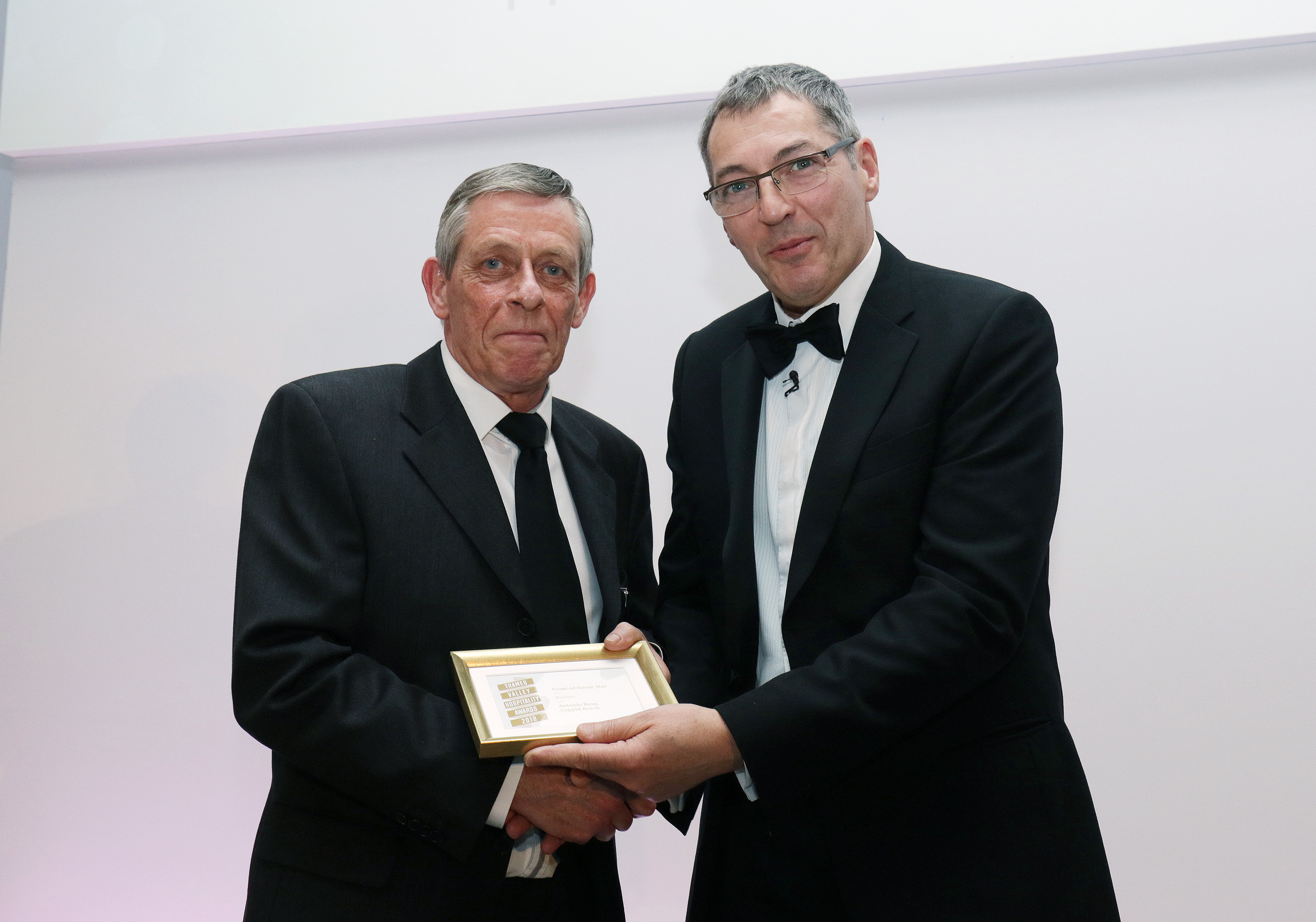 a team member picks up the award for Antonio Rosa of the Coppid Beech hotel, bronze for Front-of-Hou