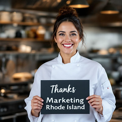 middle aged chef holding up a sign with the words Thanks Marketing Rhode Island