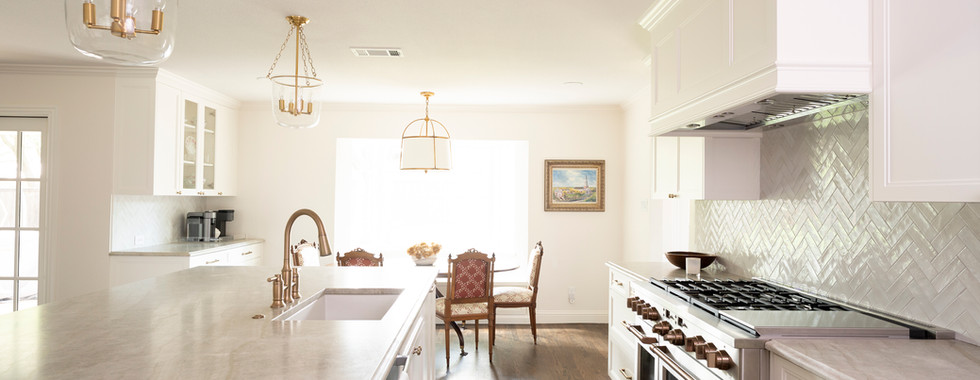 chef's kitchen with quartzite countertops and stainless steel appliances