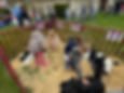 Kids pet calves during the annual Prairie Central "FFA Day" with Dominy Library and Dave's Supermarket.