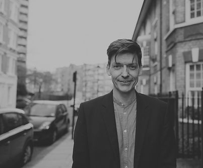 Copy of Glen smiling headshot_edited.jpg