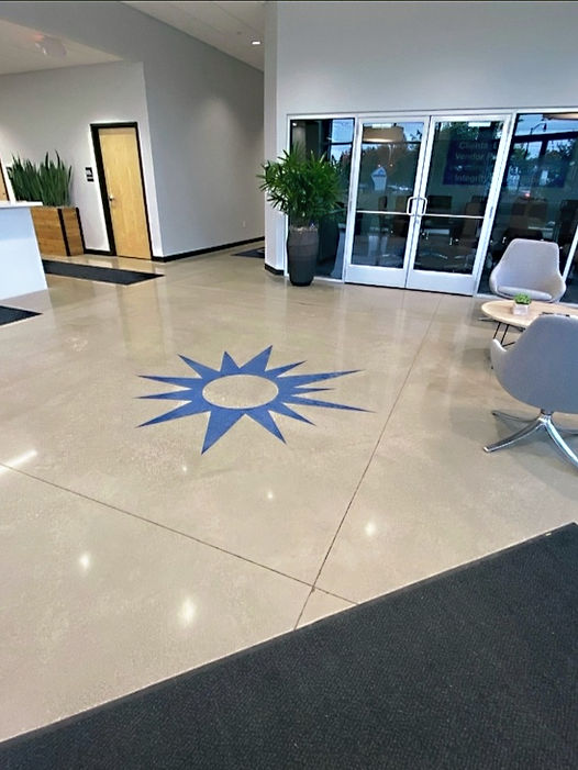 Entry level polished concrete with stained logo.