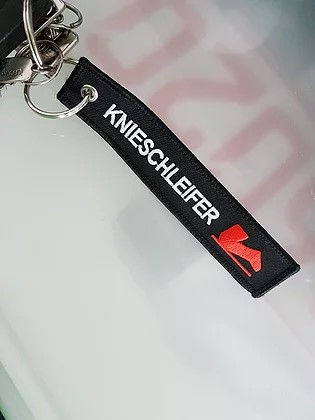 Miniaturbild: Knieschleifer-Schlüsselanhänger