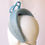 Thumbnail: Light Pale Baby Blue Classic Headband Headpiece by Catherine Storm Millinery side view