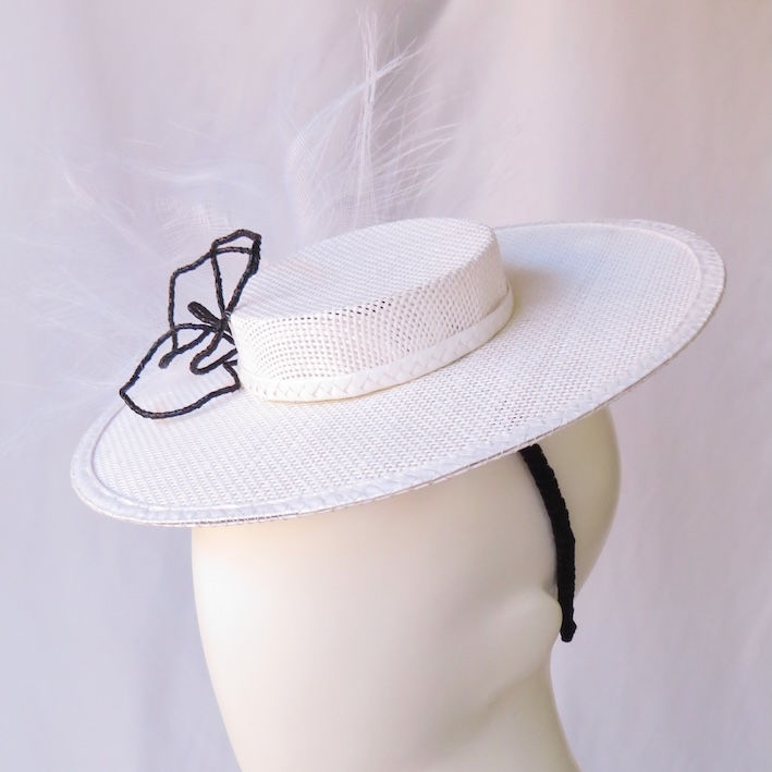 White and Black Mini Boater by Catherine Storm Millinery left view