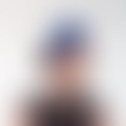 A blue Ascot bandeau headband headpiece by Catherine Storm Millinery