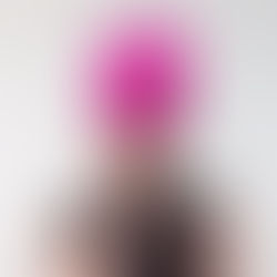 Bright pink statement headpiece worn at an angle, styled for race wear with a confident, elegant look.