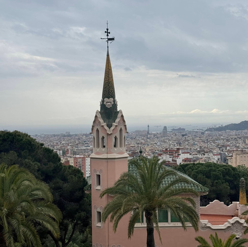 A pink building with a green spire