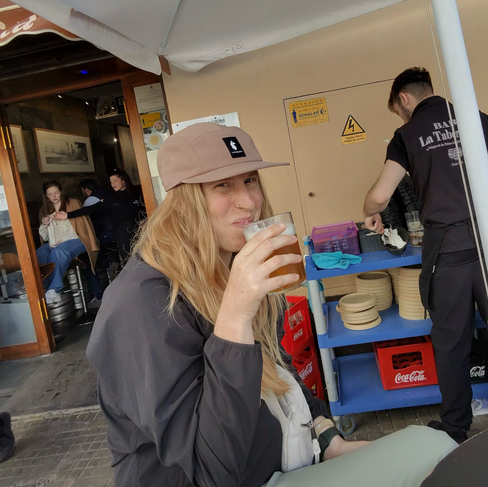 A woman drinking a beer