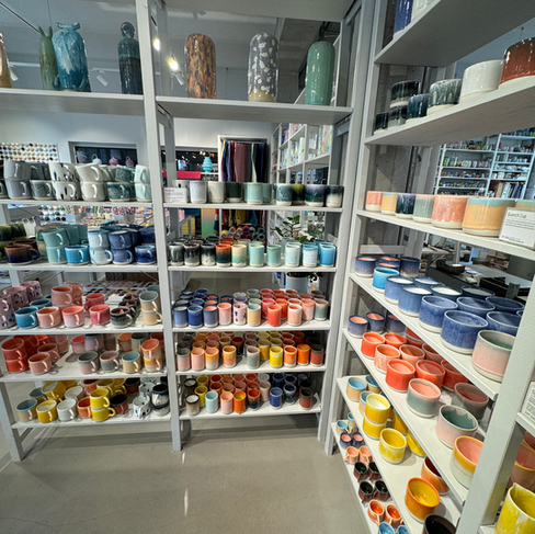 Shelves with colorful ceramic cups