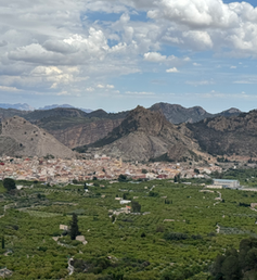 A mountainous region with a valley and small town