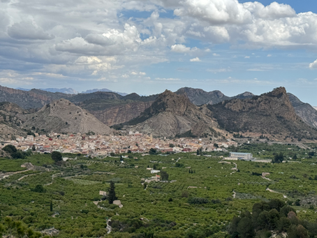 A mountainous region with a valley and small town