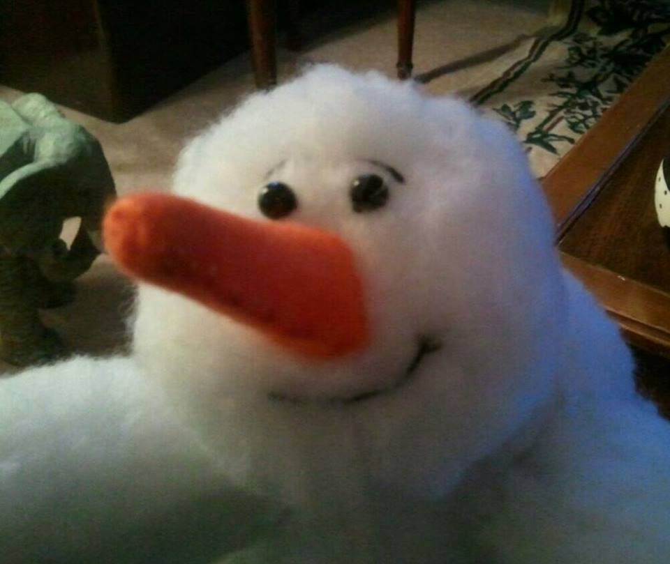 Smiling snowman bringing some wintertime cheers!