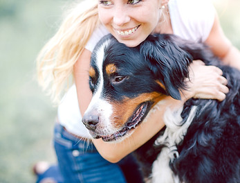 Woman Hugging Dog