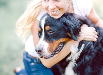 Woman Hugging Dog