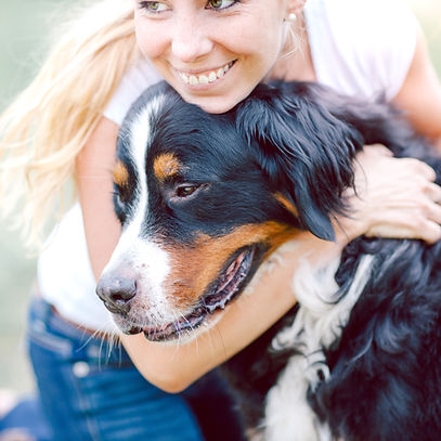 Woman Hugging Dog