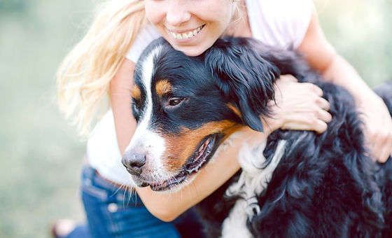 Woman Hugging Dog