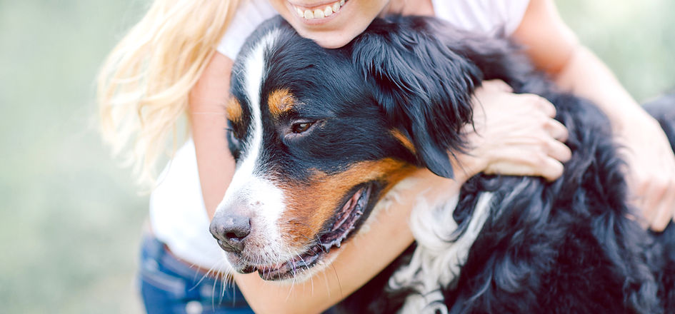 Woman Hugging Dog