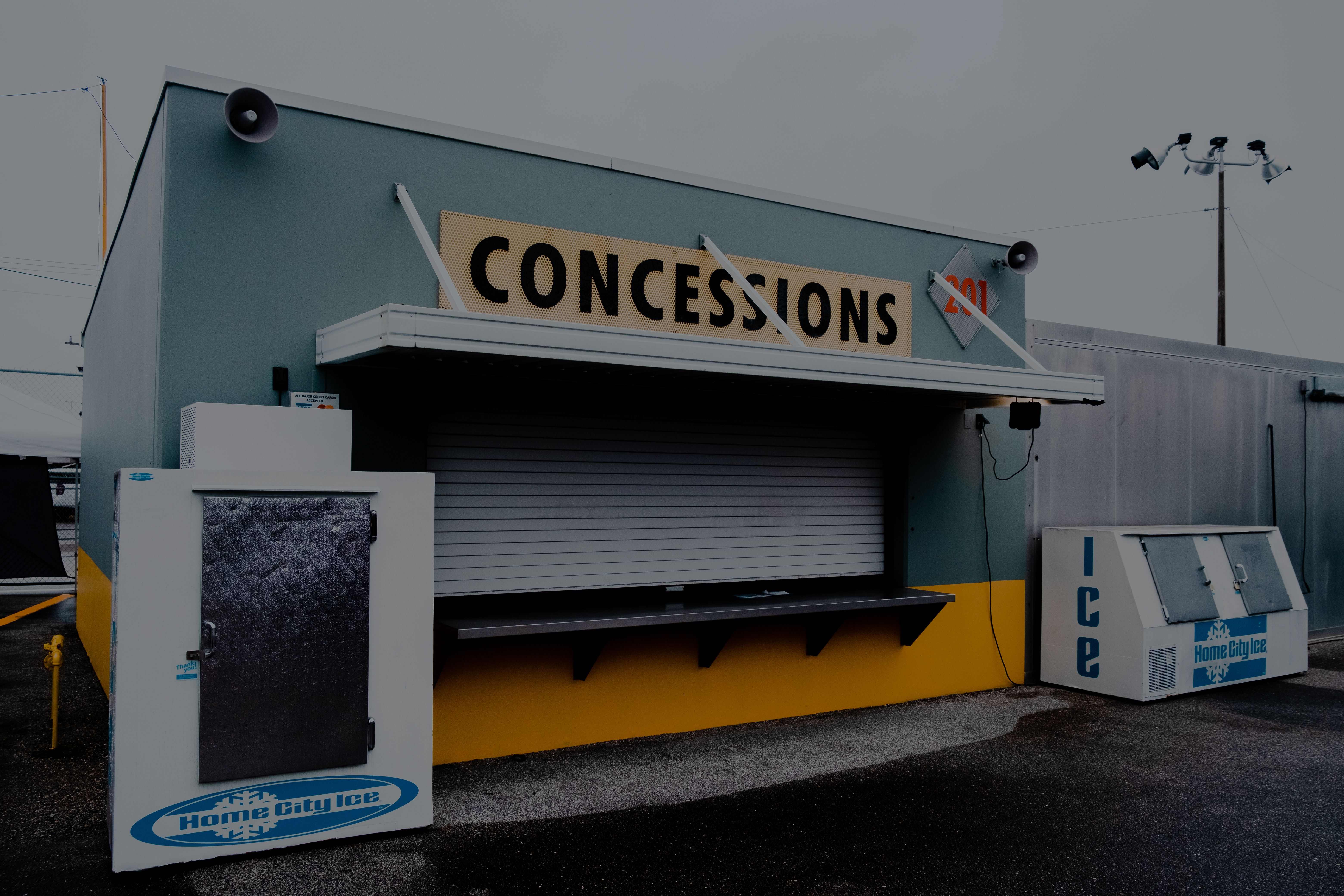 Outdoor ice storage freezers beside a concession stand