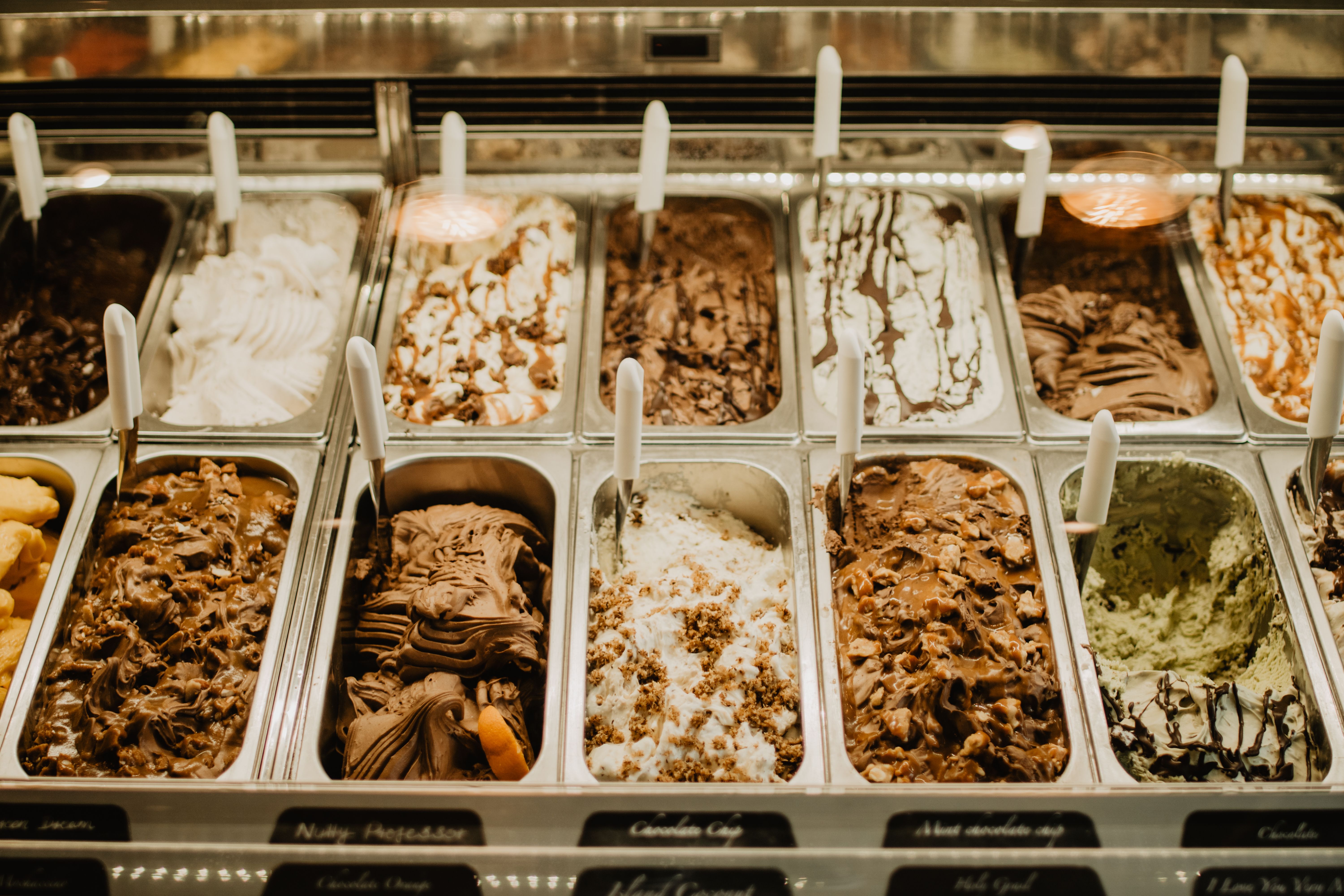 Stainless steel trays inside a commercial gelato display freezer