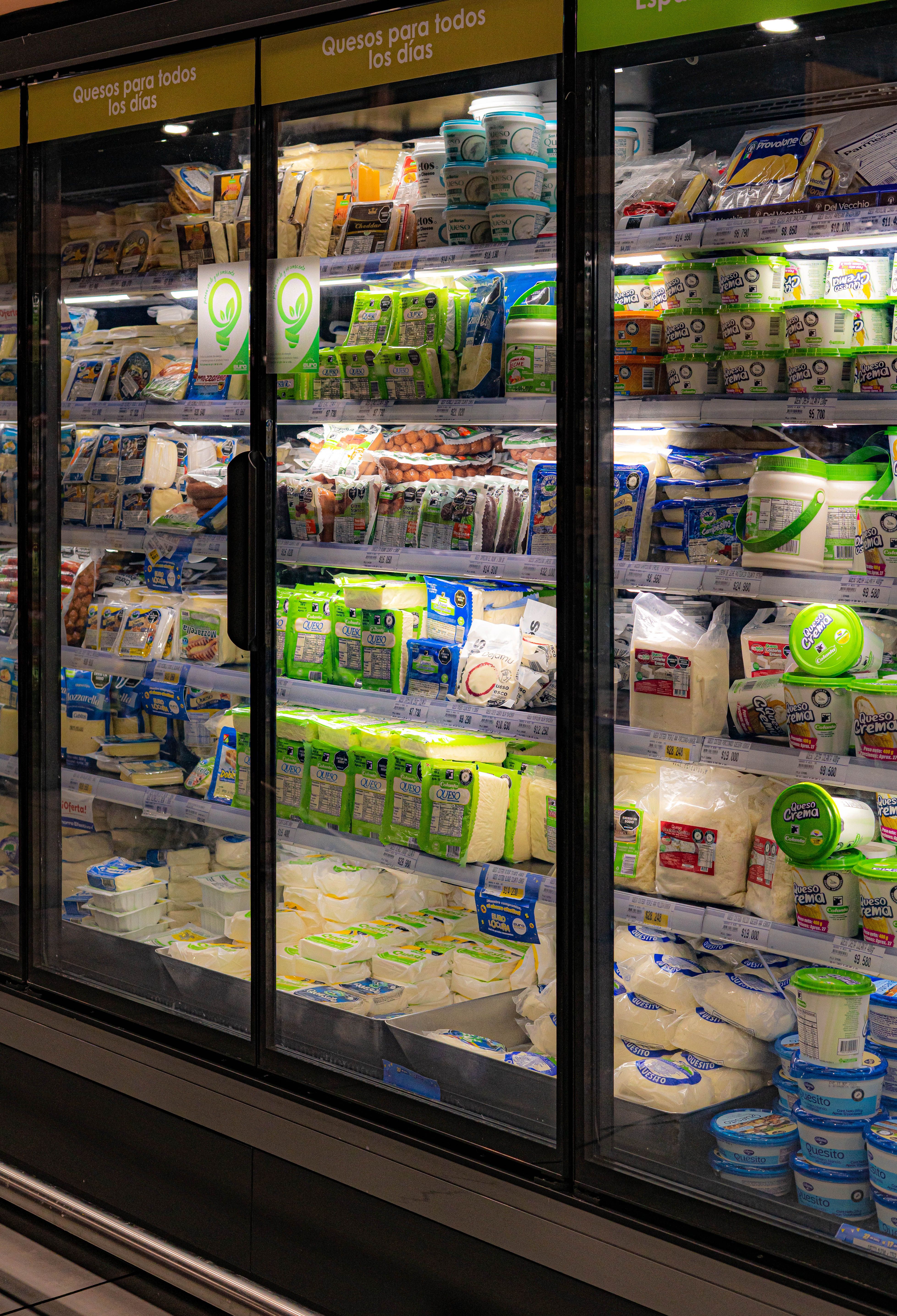 Commercial refrigerated display cases holding dairy and plant-based foods