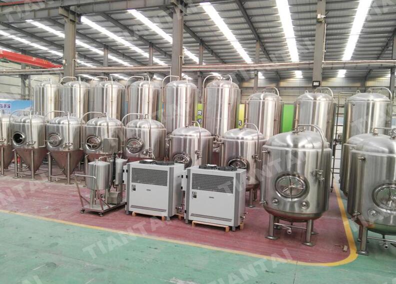 Beverage production facility with cooling equipment and storage tanks