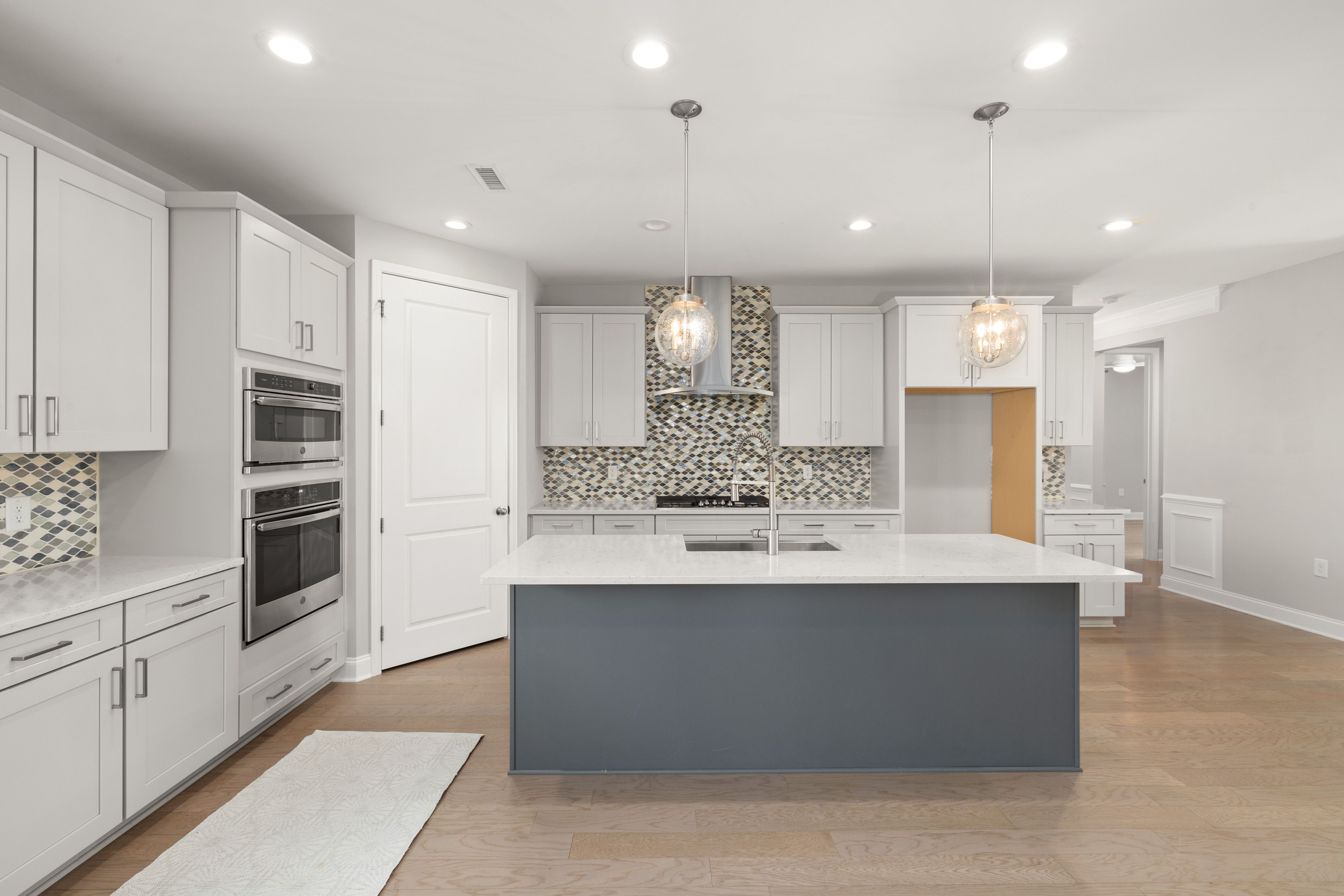 Bright kitchen with an island and pendant lights