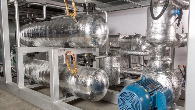 Industrial refrigeration equipment with piping and insulated vessels