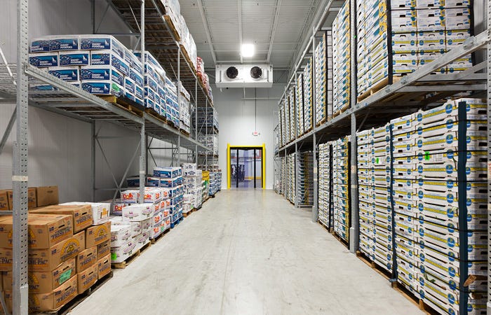 Stocked walk-in cold room with overhead evaporator fans