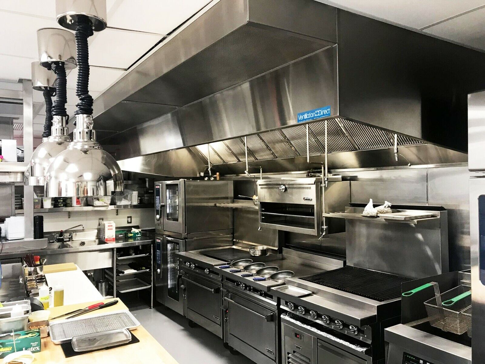 Professional restaurant kitchen with stainless-steel work areas