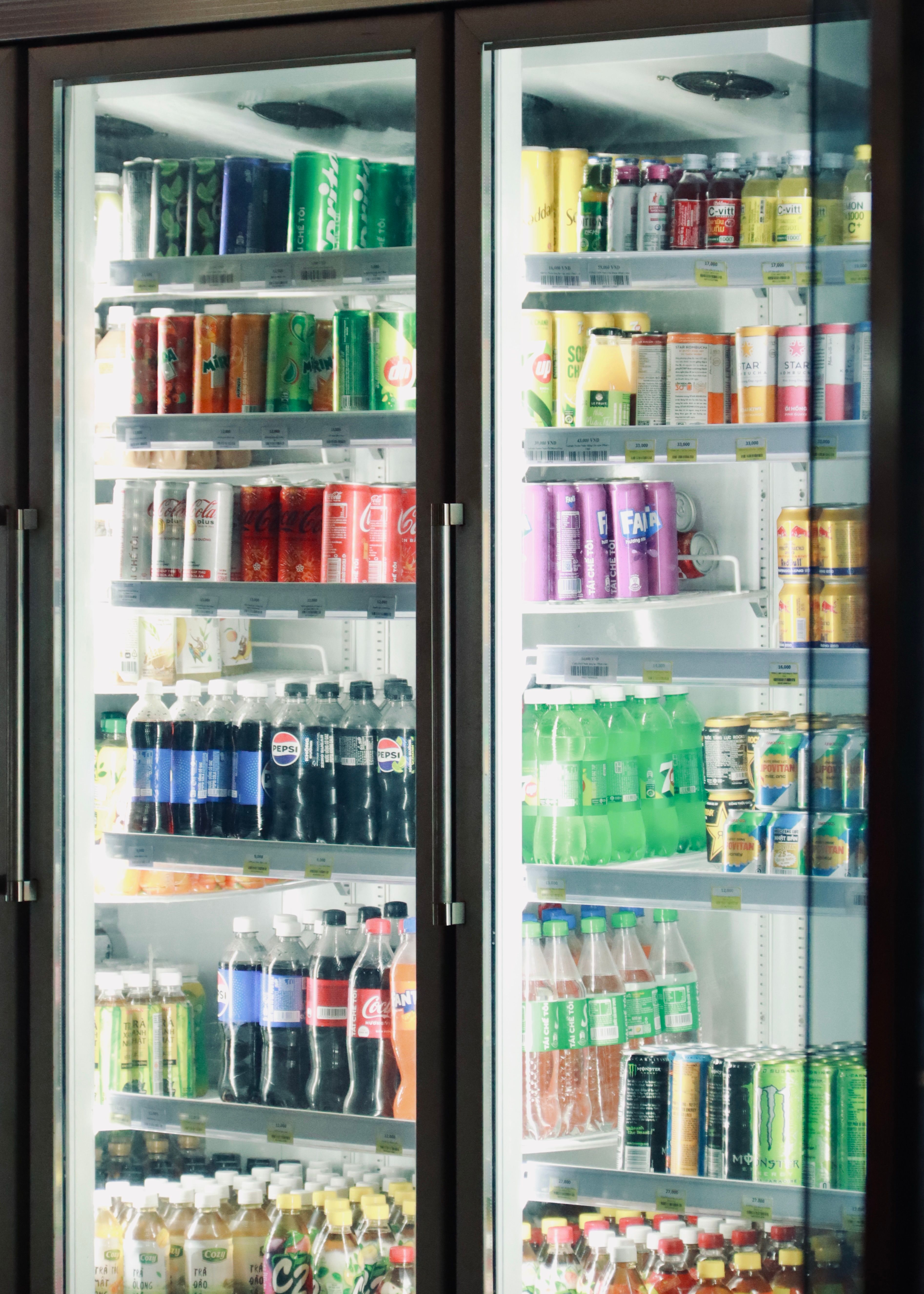 Glass-door beverage cooler with illuminated refrigerated shelves