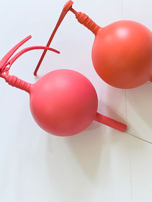 Sculpture you resembling vintage spray bottles or enormous toy water guns.  existential anxiety over the contemporary human condition and environment. 
 a couple