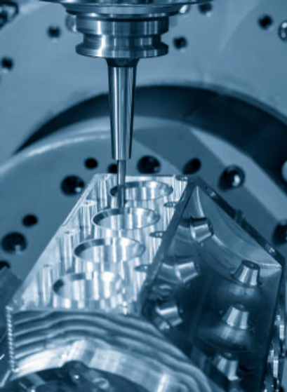 5 axis CNC machine cutting a high complex engine component.