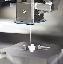 Wire EDM machine cutting a complex tight tolerance profile