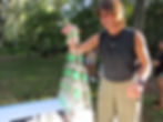 Person making a cup tower with Earth Cups