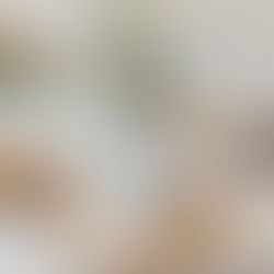 GROSCHE Milano moka pot in white on a bench with breads and coffee beans.