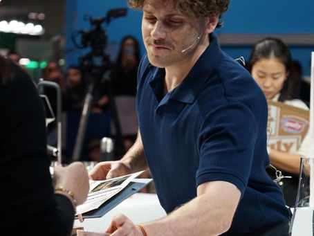 Jack Simpson serving judges with Ni Wares cups.