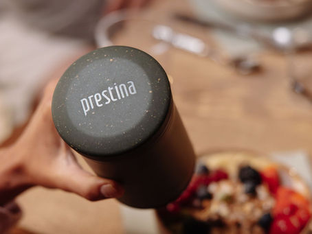 Lady pouring water into Prestina using kettle