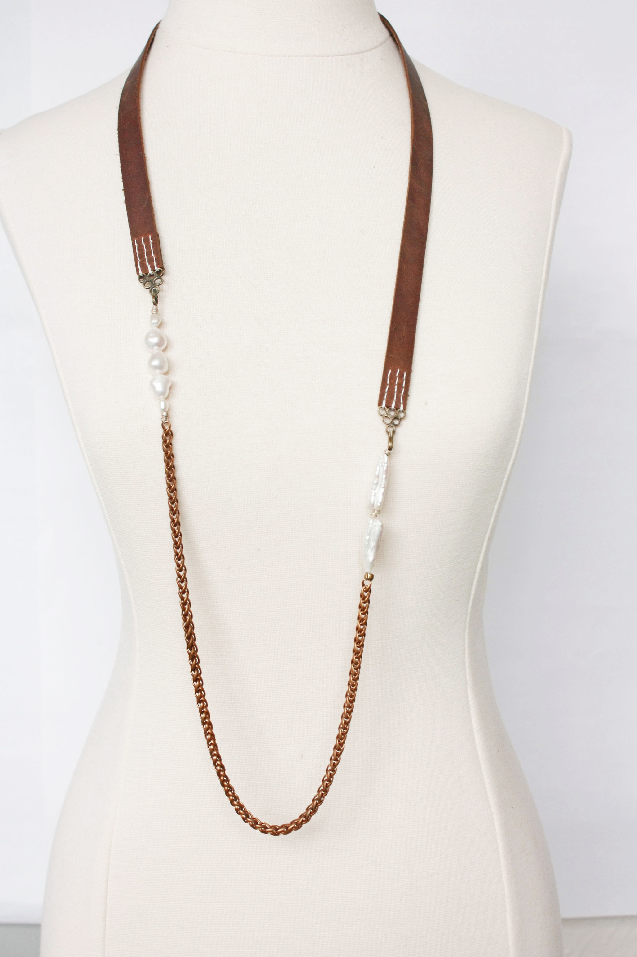 Hand stitched leather with fresh water Pearls