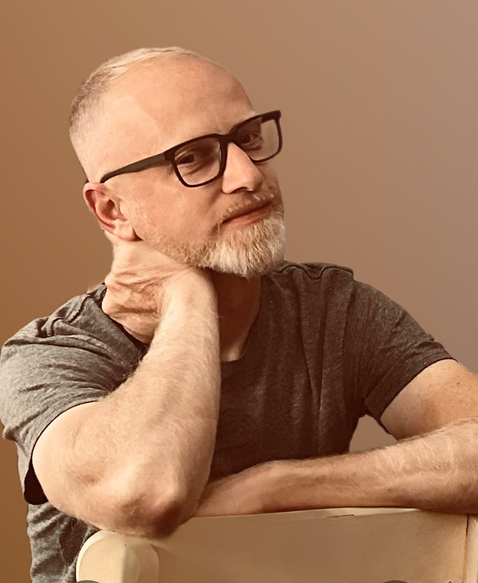 chris - picture of man, white with glasses, mid 40's in a grey t-shirt