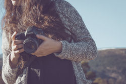 Woman Holding a Camera