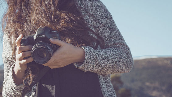Woman Holding a Camera