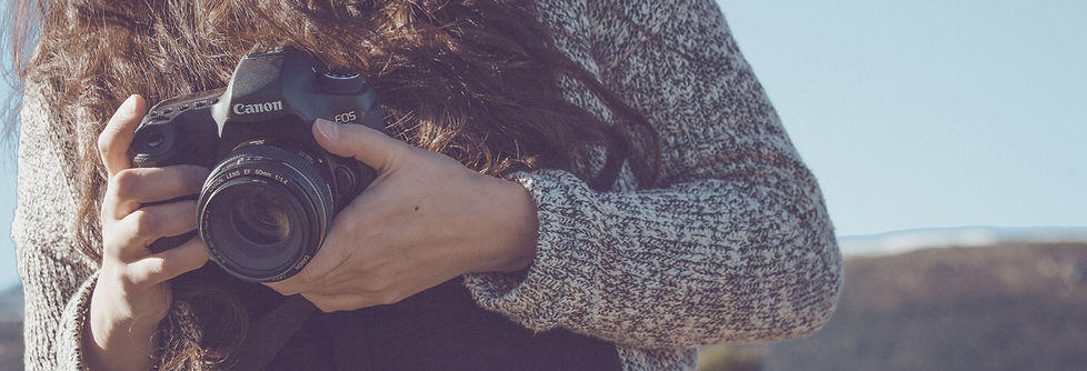 Woman Holding a Camera