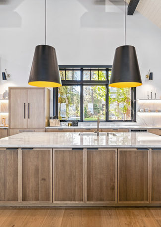 Large and open kitchen, with luxury appliances and upscale finishes.