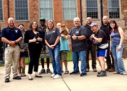 Law Enforcement Officers pose with participants at National Night Out