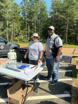 Cpl Moats and Major Fearrnington grill hot dogs