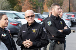 candid shot of deputies at ribbon cutting