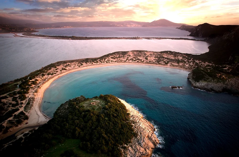 an aerial view of a beach and a body of .jpg.webp