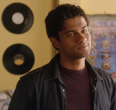 Rahul Parikh as Another Slick Dude in "Warmed-Over Krautrock"